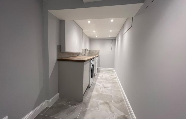 Completed converted cellar interior with fitted cupboards in Clapham