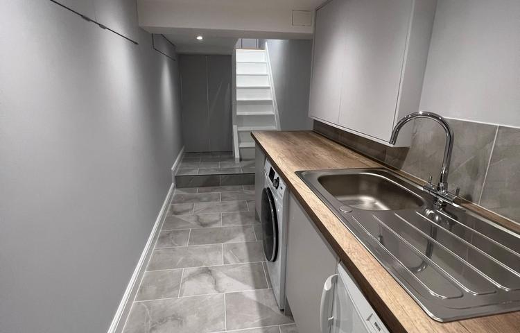 Completed converted cellar interior with fitted cupboards in Clapham