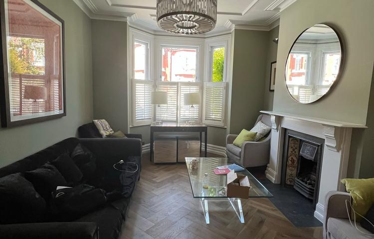 Refurbished living room with new wood flooring in Clapham