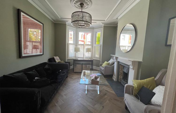 Refurbished living room with new wood flooring in Clapham