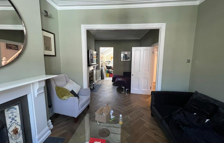 Refurbished living room with new wood flooring in Clapham