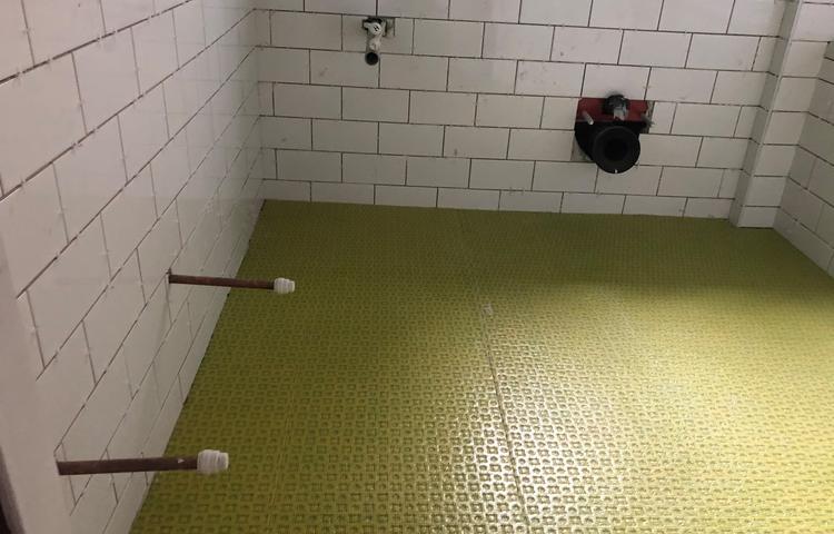 Shower floor tiling preparation in Lewisham