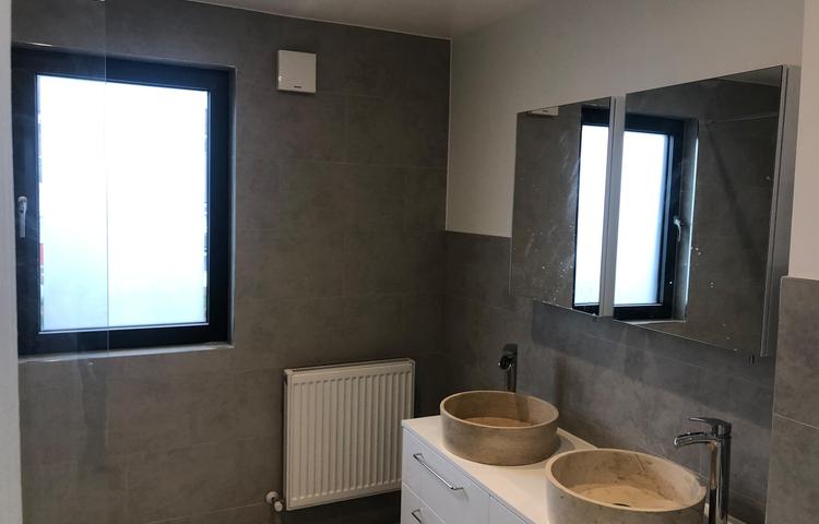 Bathroom with double-basin vanity and grey tiling in Lewisham