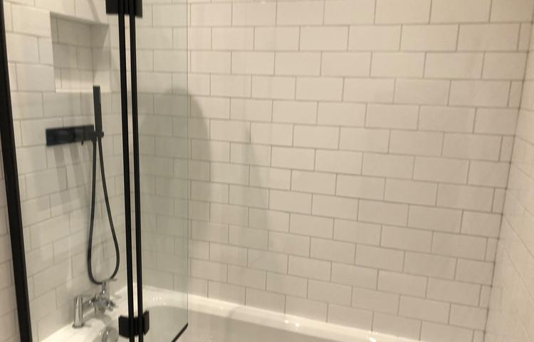 New white-tiled shower with black fittings in Lewisham