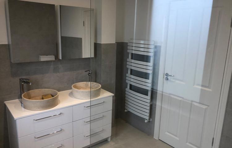 Bathroom with floating double vanity and grey tiles in Lewisham