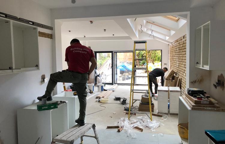 Kitchen fitting work with tradespeople on site in Lewisham