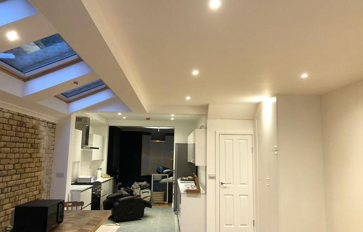 Open-plan kitchen and living area with exposed brick in Lewisham