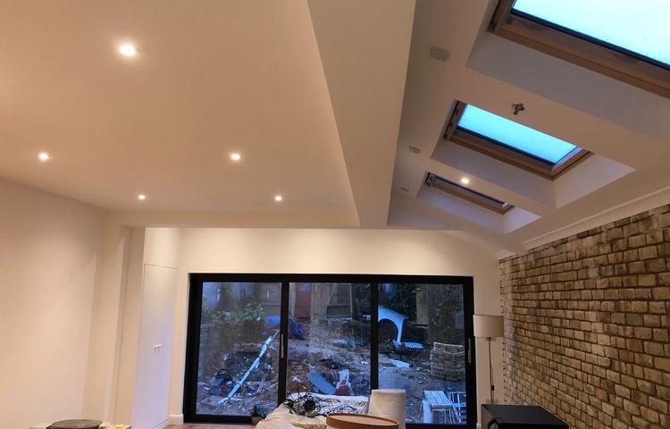 Rooflights and large glass doors over the living area in Lewisham