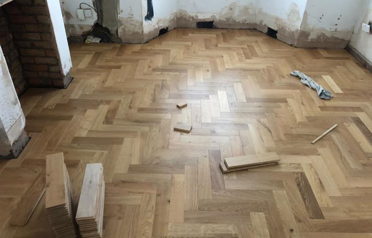 Partly laid parquet wood flooring in Lewisham
