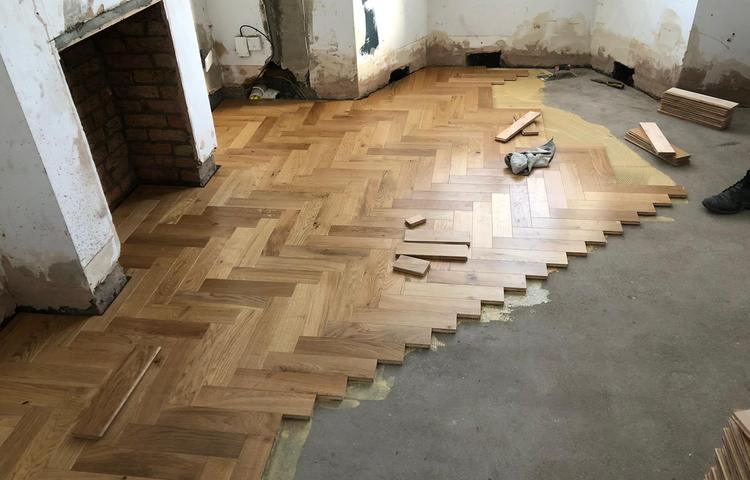 Herringbone parquet floor installation in progress in Lewisham