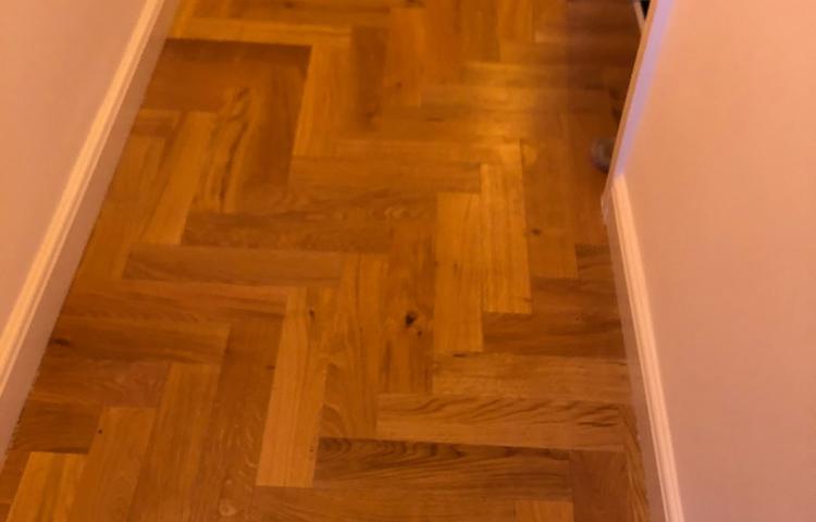 Finished parquet wood flooring in the hallway in Lewisham