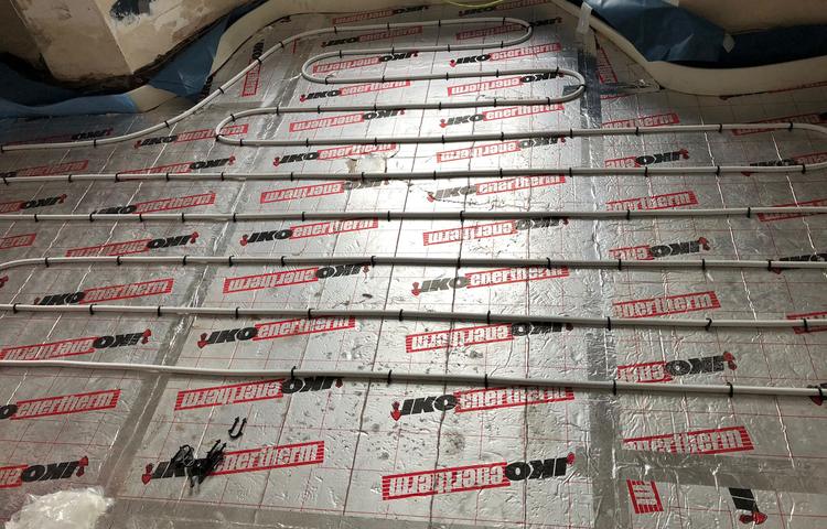 Underfloor heating insulation boards and pipe layout in Lewisham