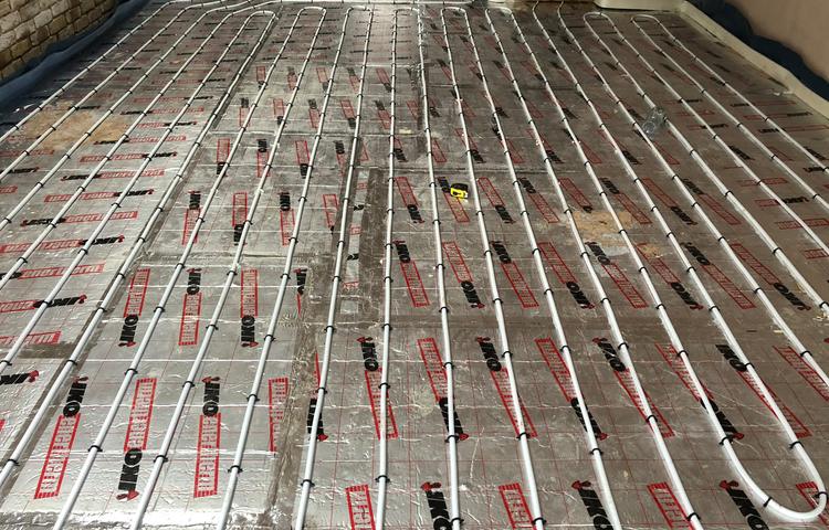 Underfloor heating pipework across the ground floor in Lewisham